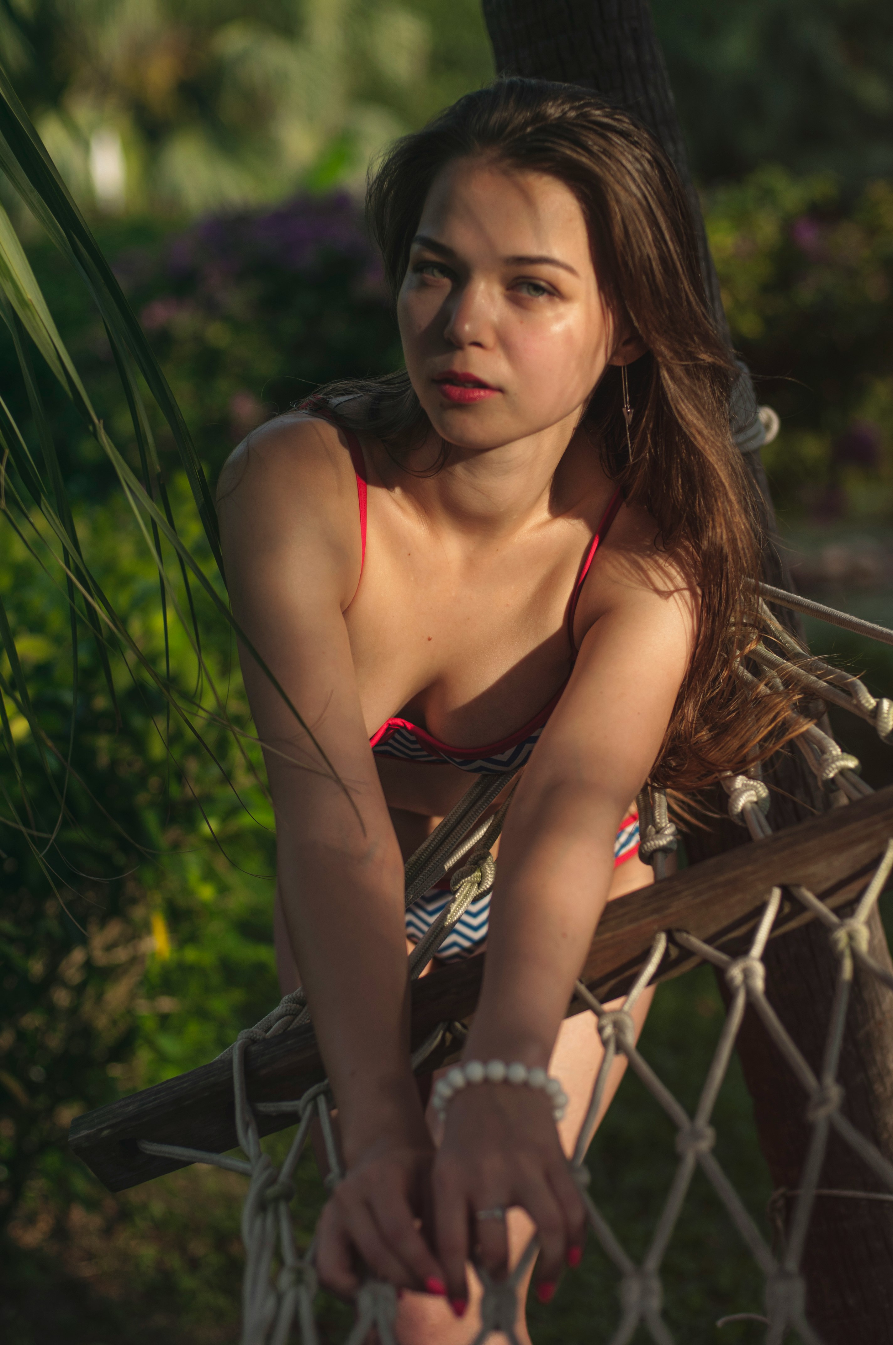 woman leaning on hammock